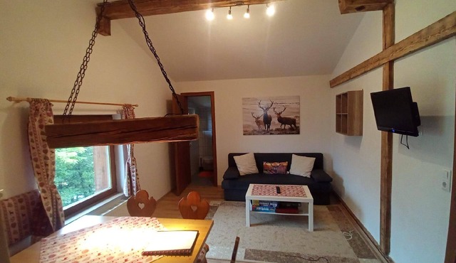 Holiday apartment in a beautiful natural setting, with its own balcony and use of a barbecue and a playground